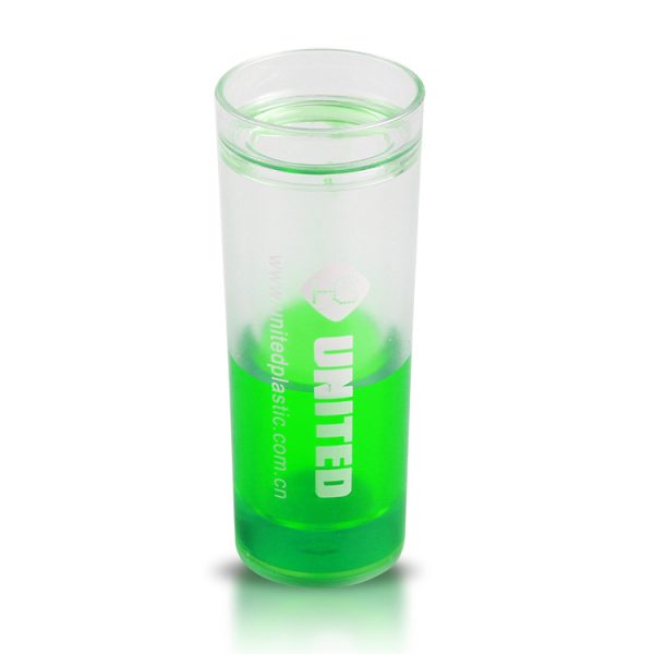 double wall green plastic shot glass with liquid